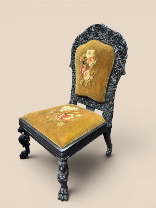 Late 19th-century Indian ebony chair, finely carved